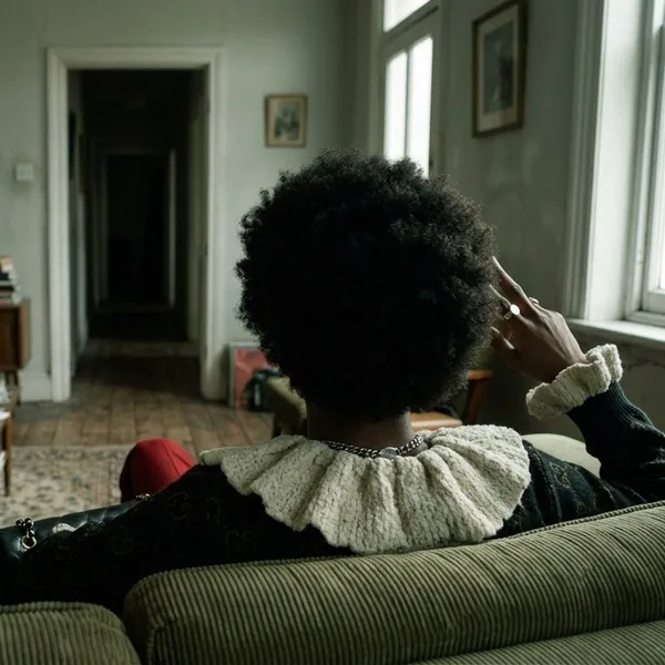 Living room shown from behind the subject's head in a reverse camera angle